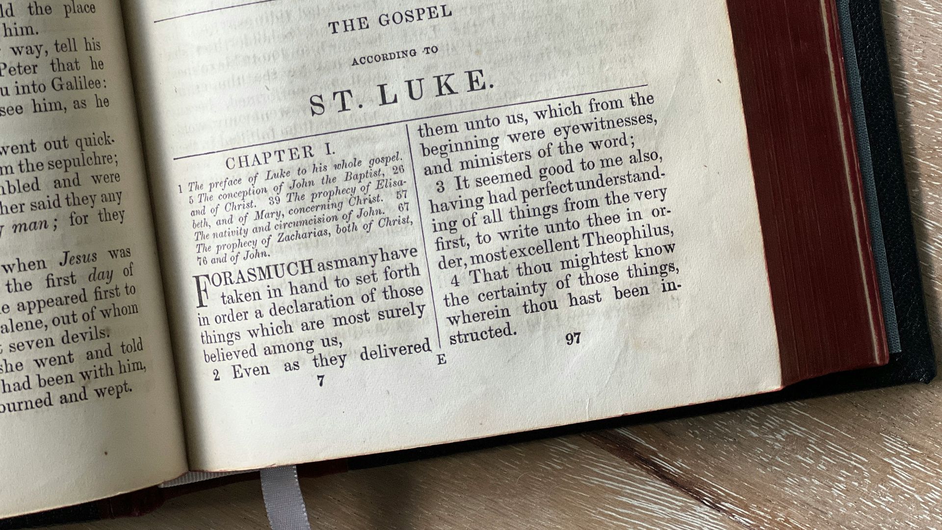 an open book sitting on top of a wooden table