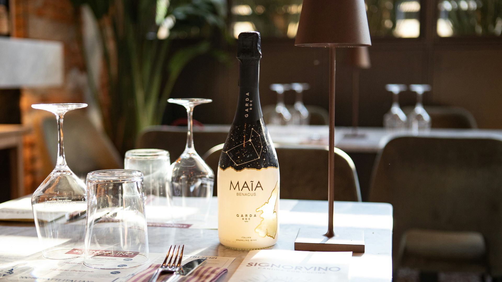 a bottle of wine sitting on top of a table