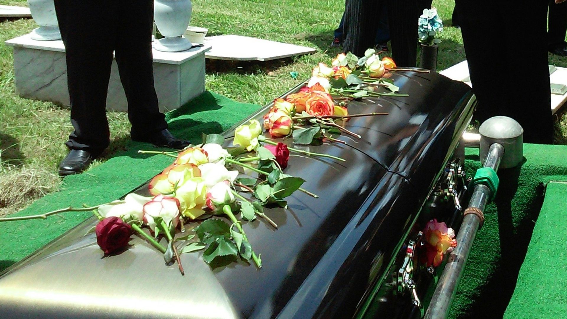 group of people attending burial