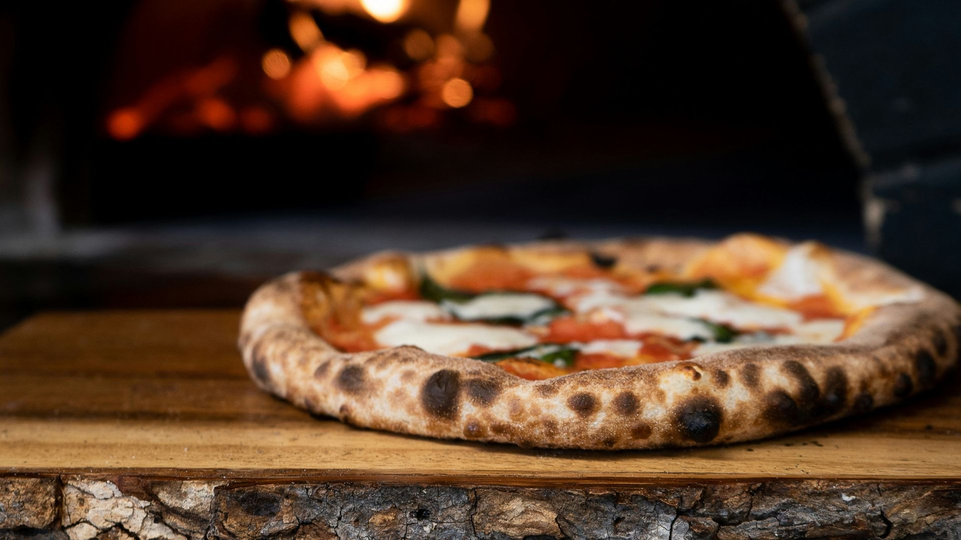 pizza on brown wooden table