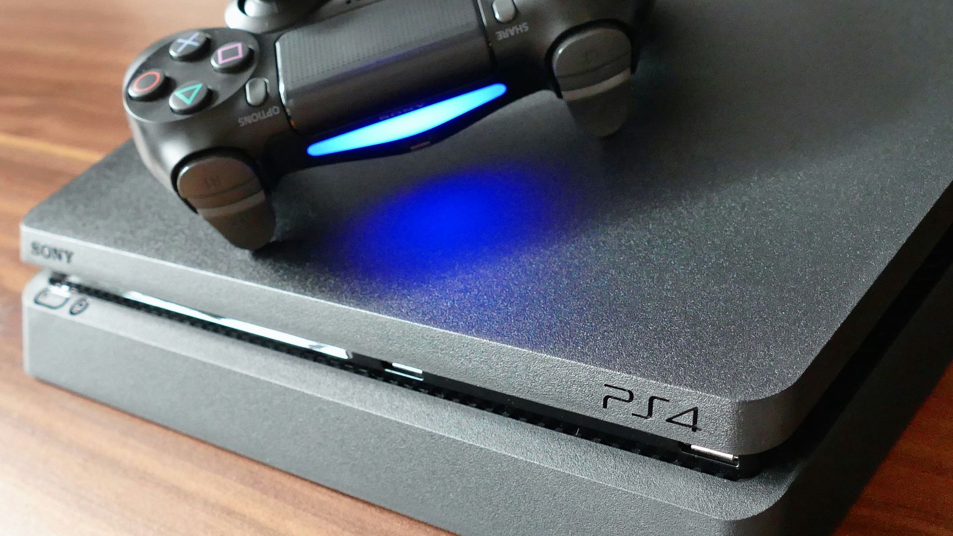 a video game console sitting on top of a wooden table