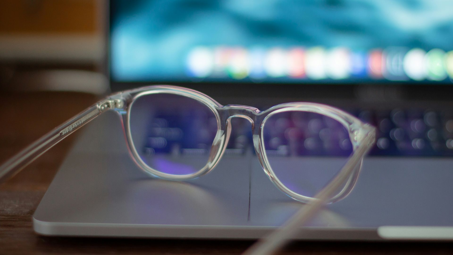 silver framed eyeglasses on white table