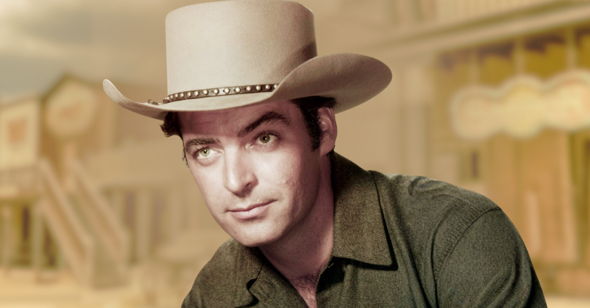 American actor Rory Calhoun (1922 - 1999) wearing a cowboy hat in a promotional portrait for 'Powder River', directed by Louis King, 1953.
