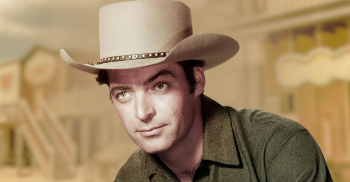 American actor Rory Calhoun (1922 - 1999) wearing a cowboy hat in a promotional portrait for 'Powder River', directed by Louis King, 1953. 