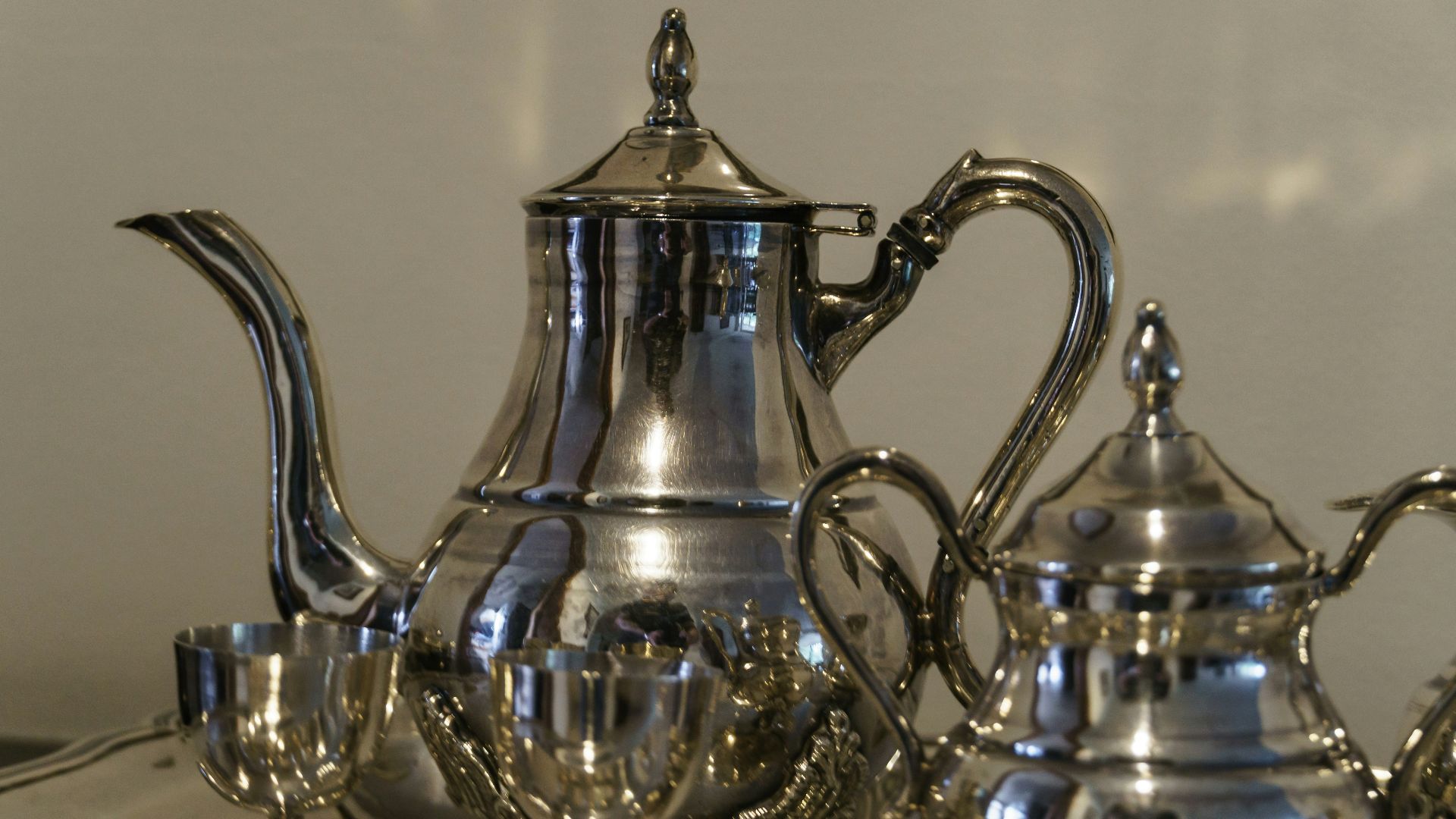 a tea kettle and glass