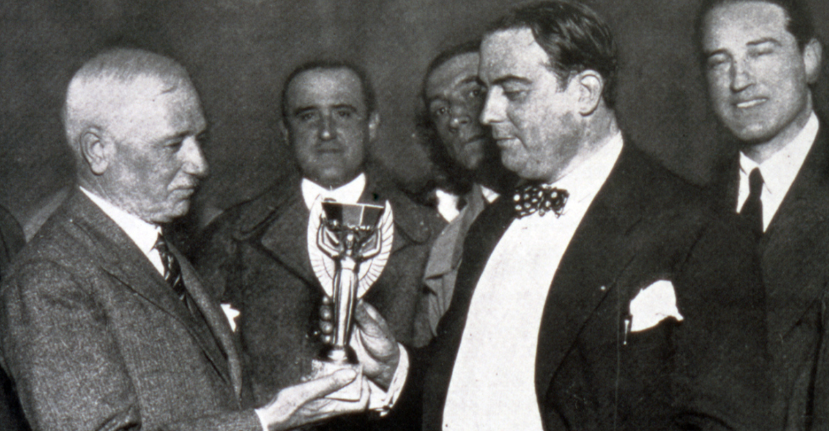 Jules Rimet (left) awarding the FIFA World Cup trophy to president of AUF, Raúl Jude in 1930.