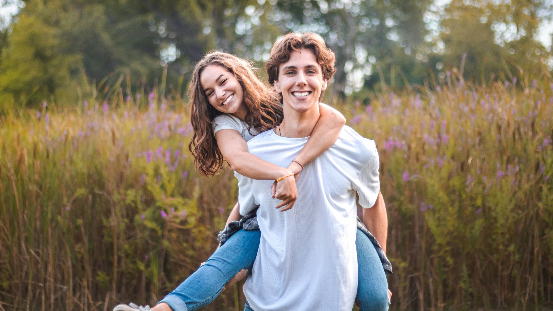 a person carrying a girl