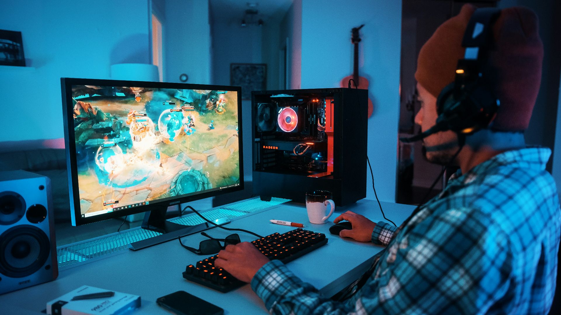 a person wearing headphones and using a computer