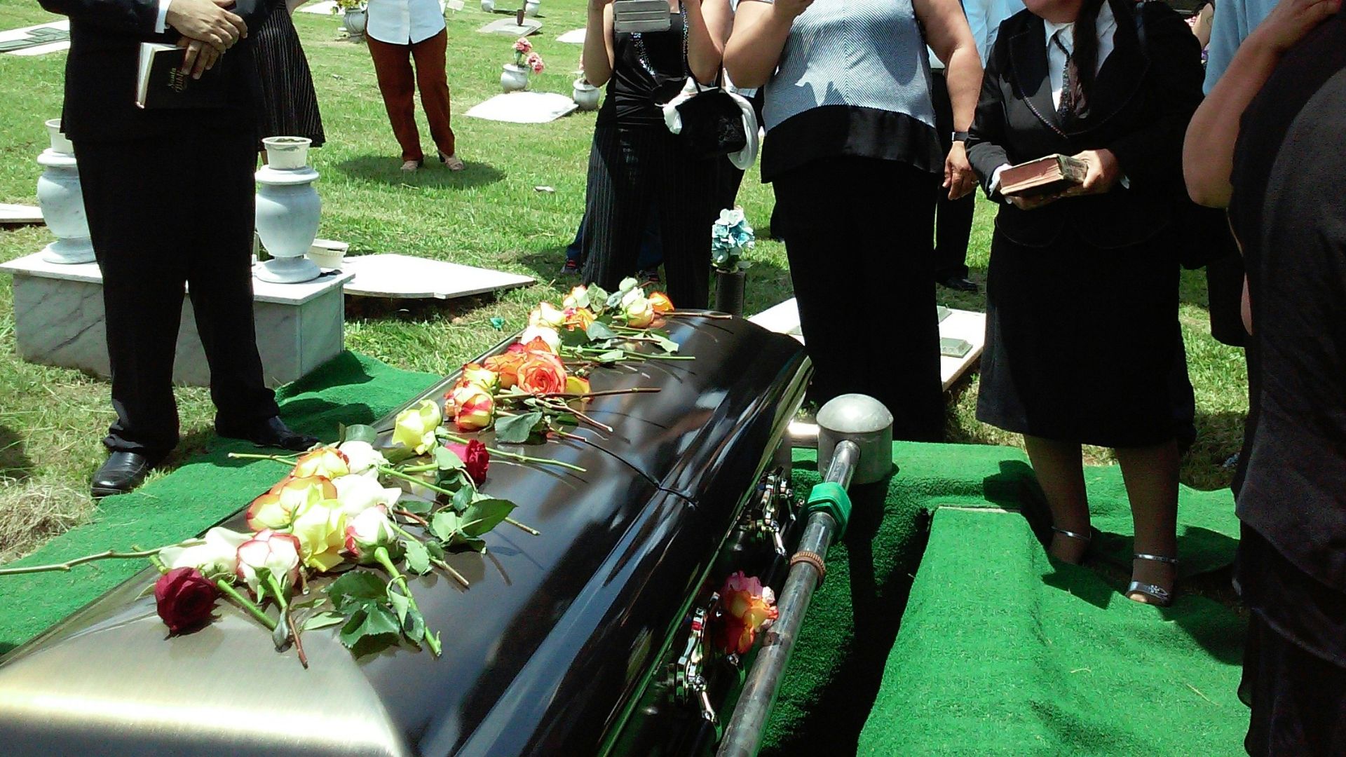group of people attending burial