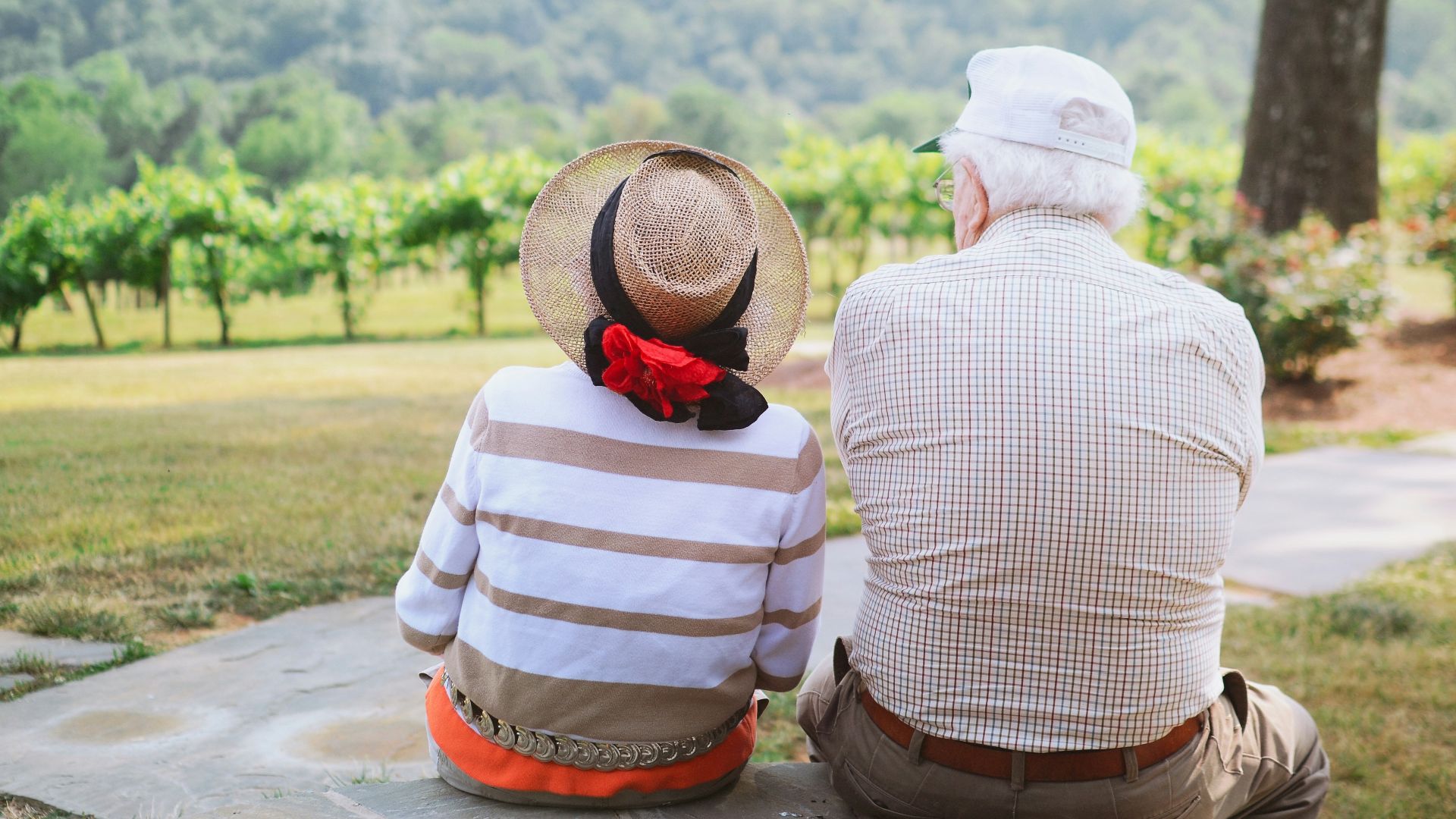 couple sitting on pathway