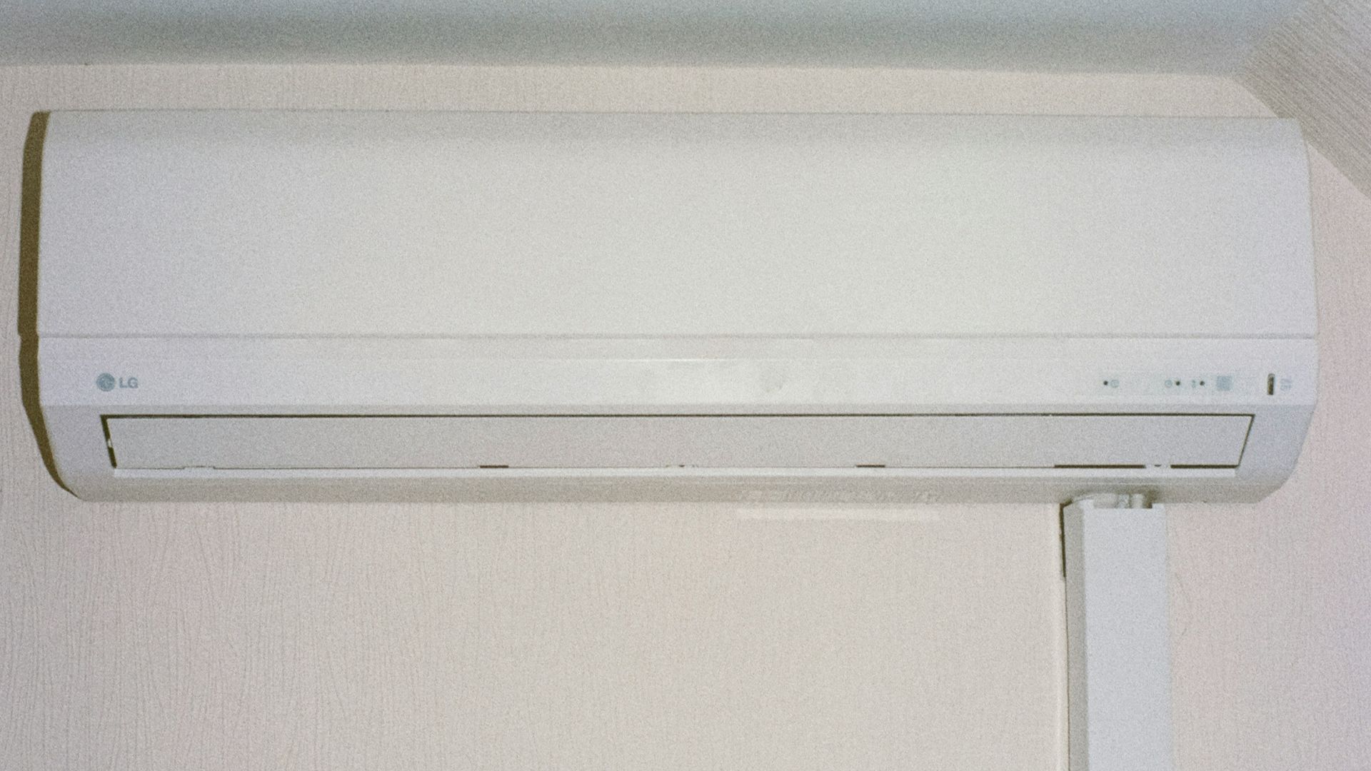 A white air conditioner mounted on a wall.