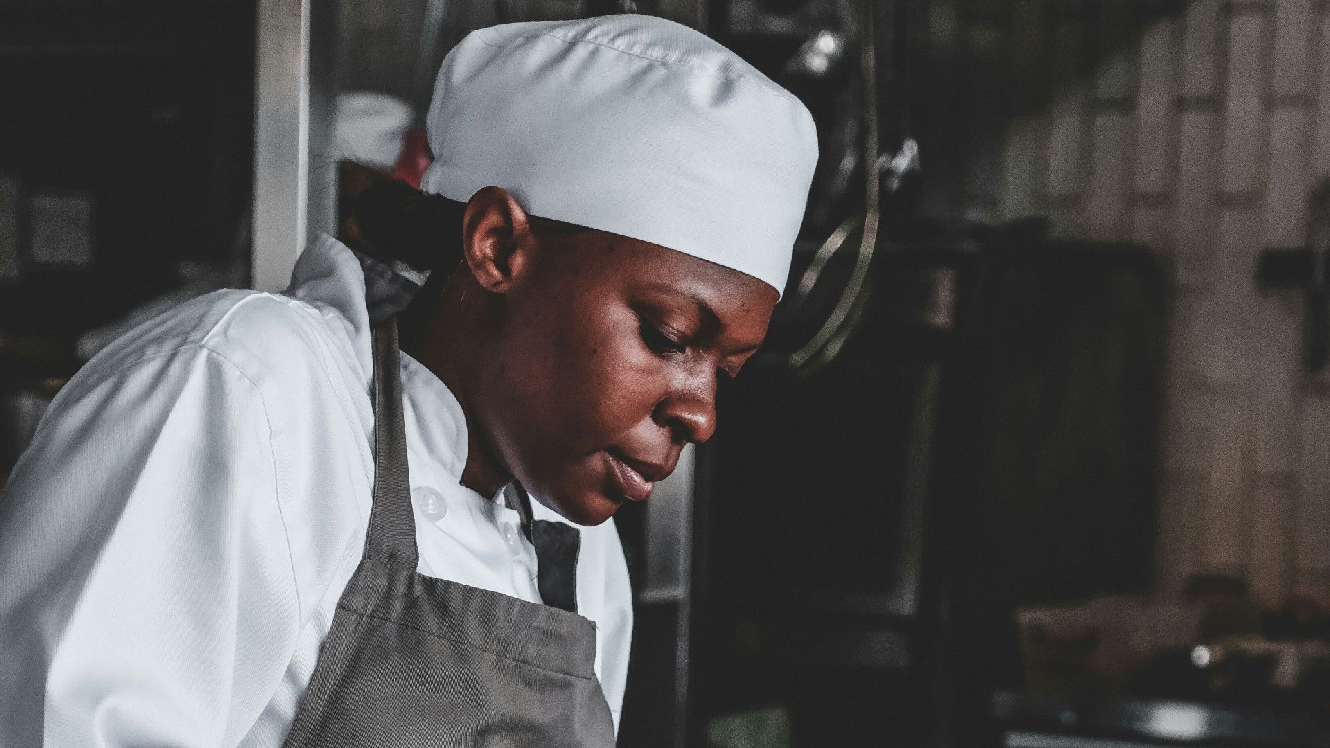 chef using knife front of bowl