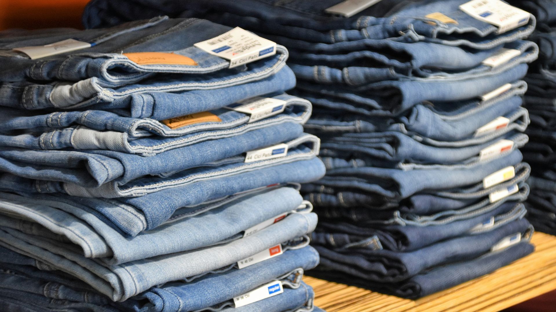 pile of blue denim jeans lot