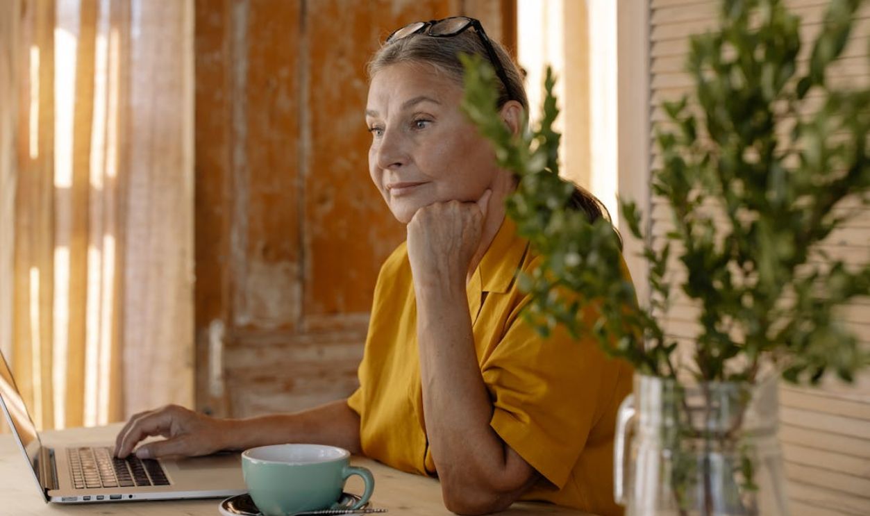 A Woman Sitting at the Table
