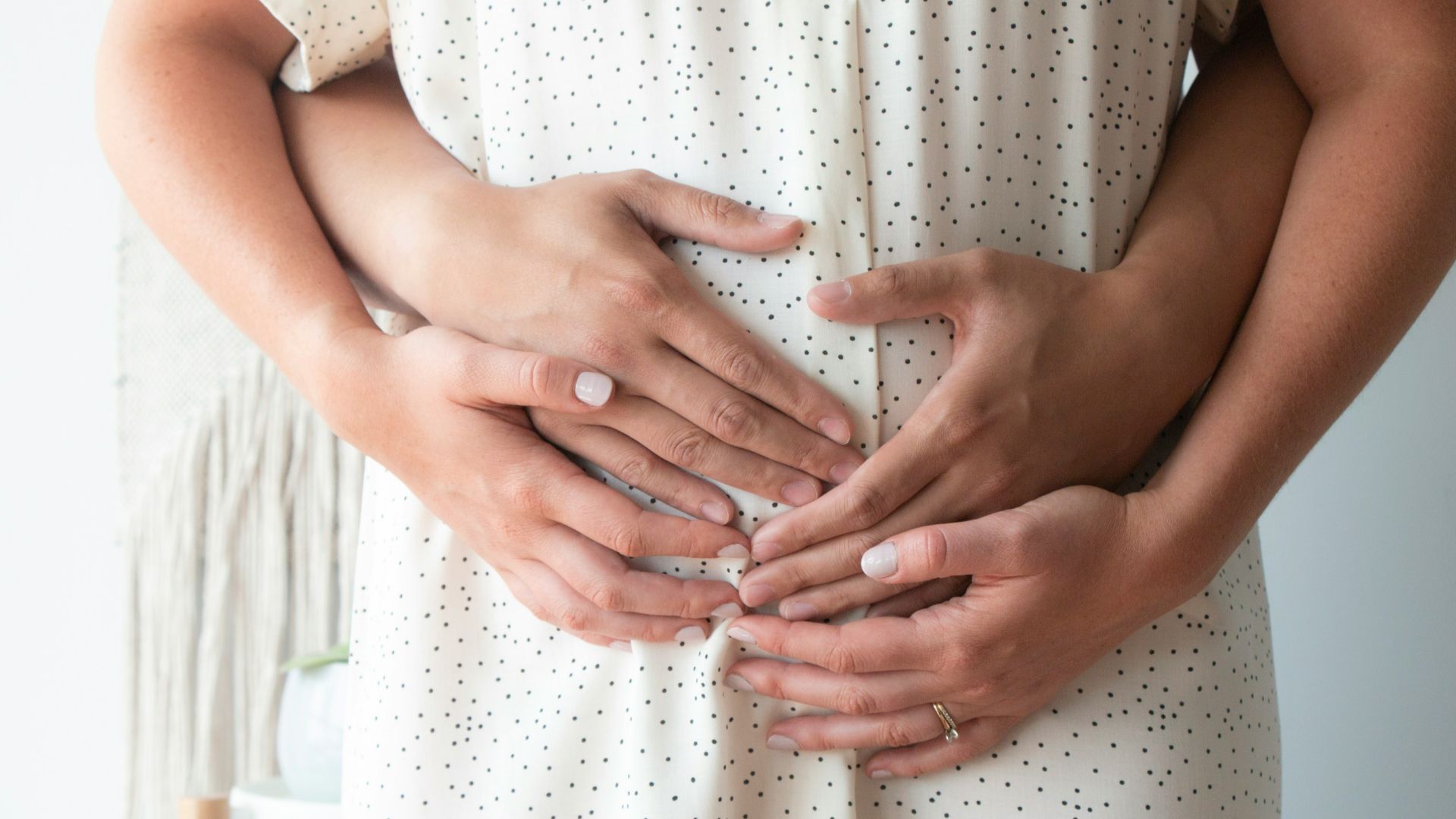 person touching person's belly