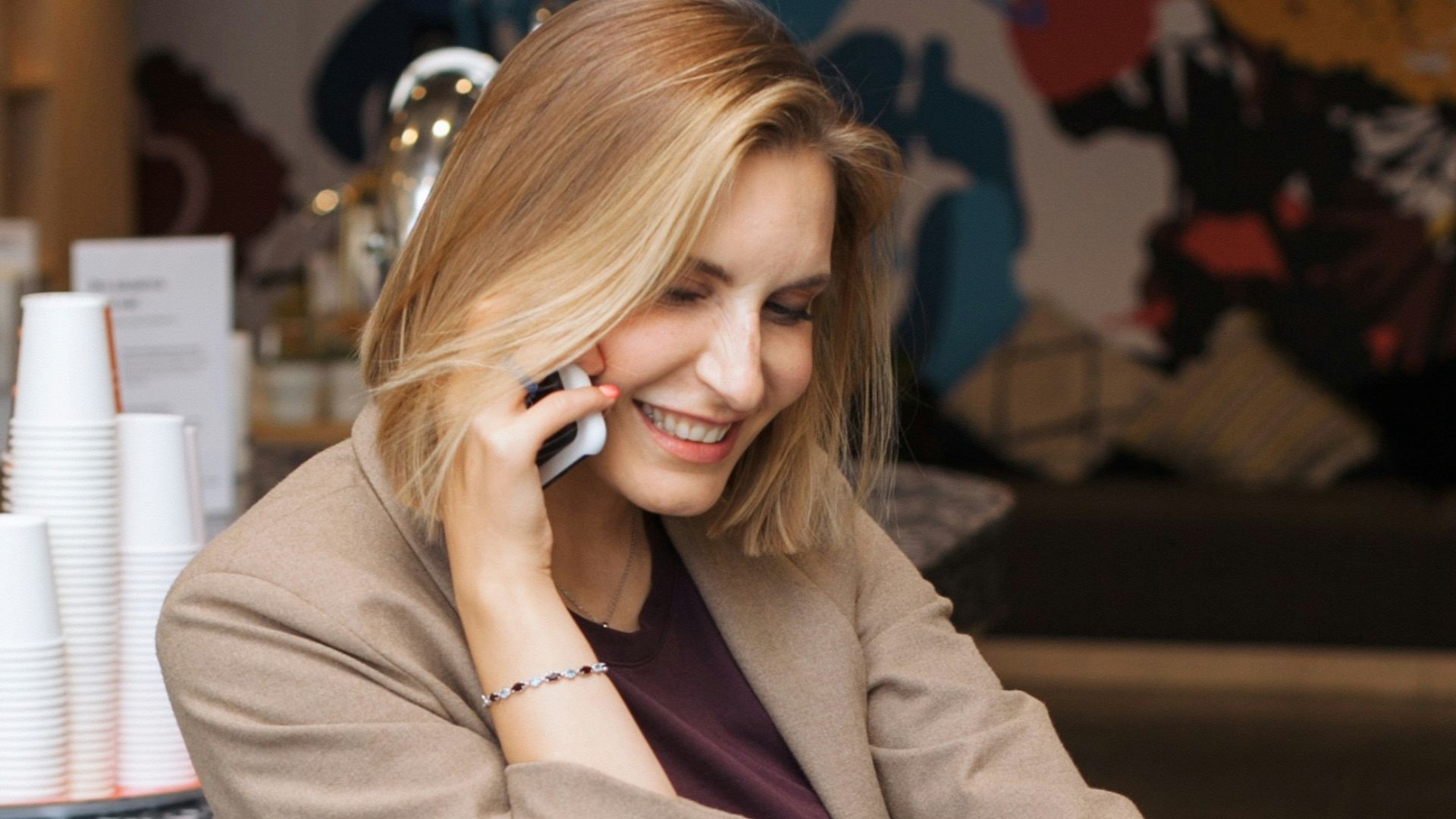 woman in blue denim jeans sitting on black metal seat