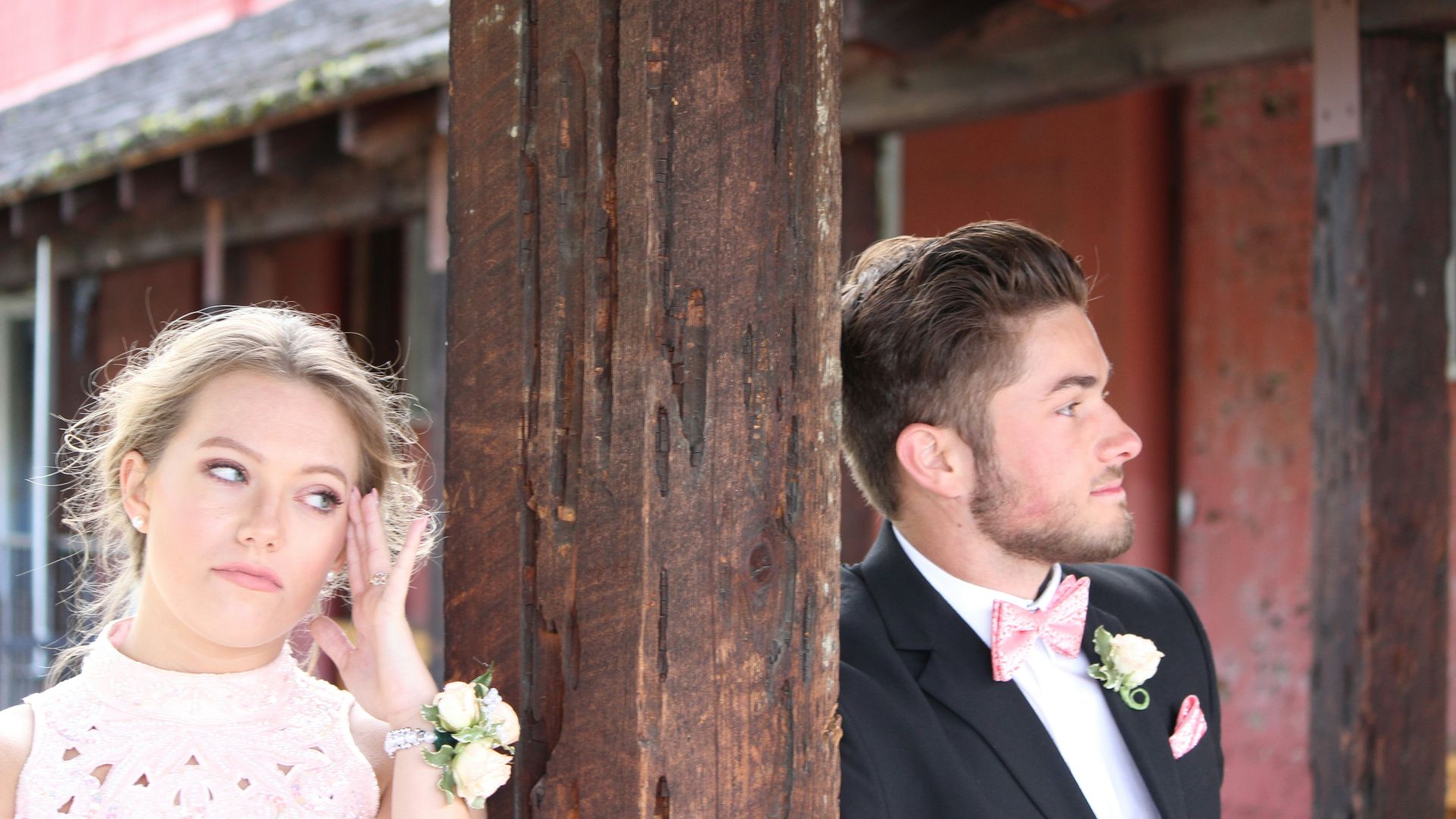 a man in a tuxedo standing next to a woman in a white dress