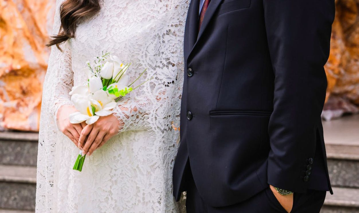 Elegant Wedding Attire with Floral Bouquet