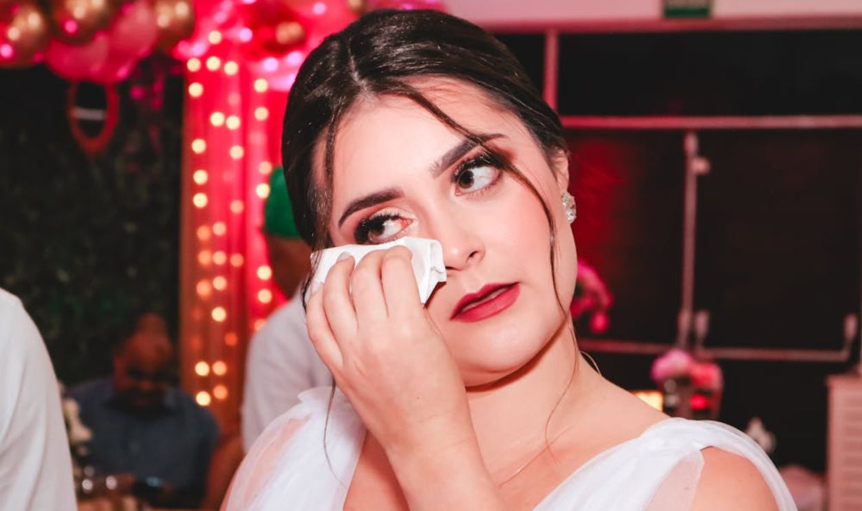 Bride Wiping Tears from her Eye