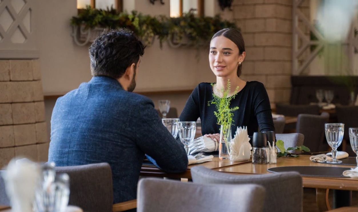 Man and Woman Sitting in a Restaurant