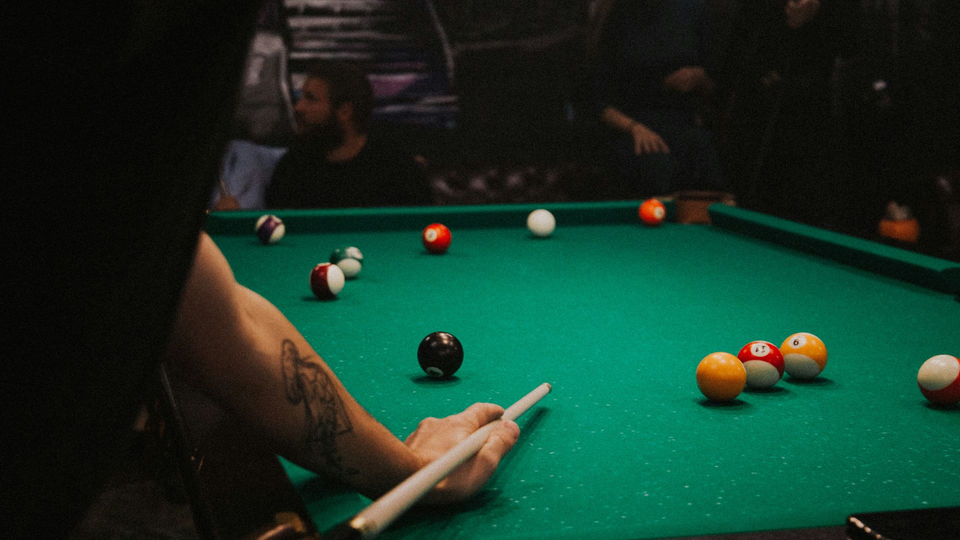 man playing pool