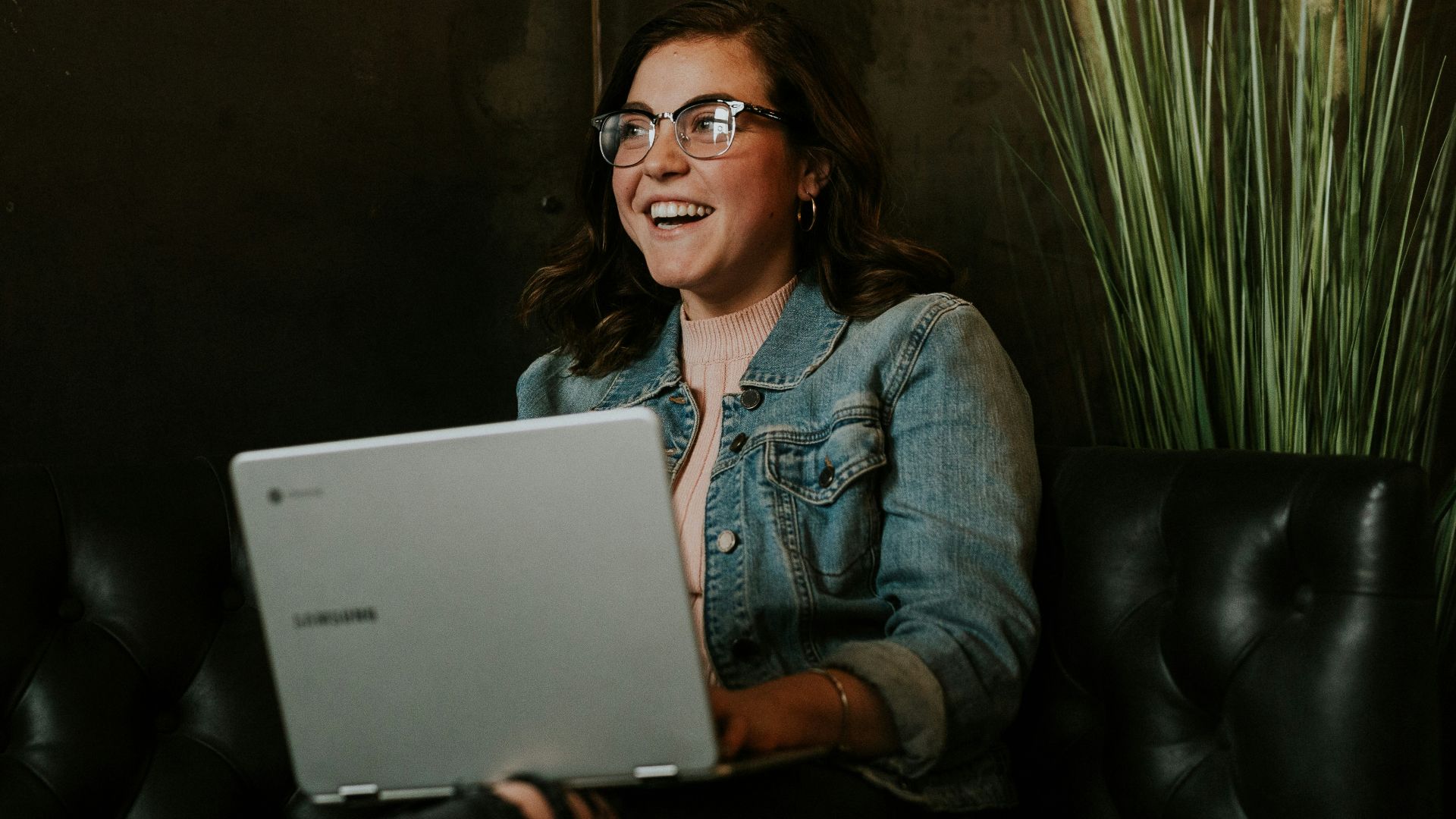 silver laptop on woman's lap