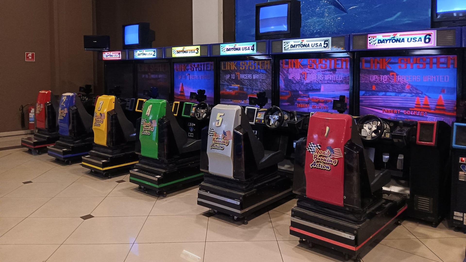 Daytona USA arcade machines at a shopping mall in São Paulo, Brazil.