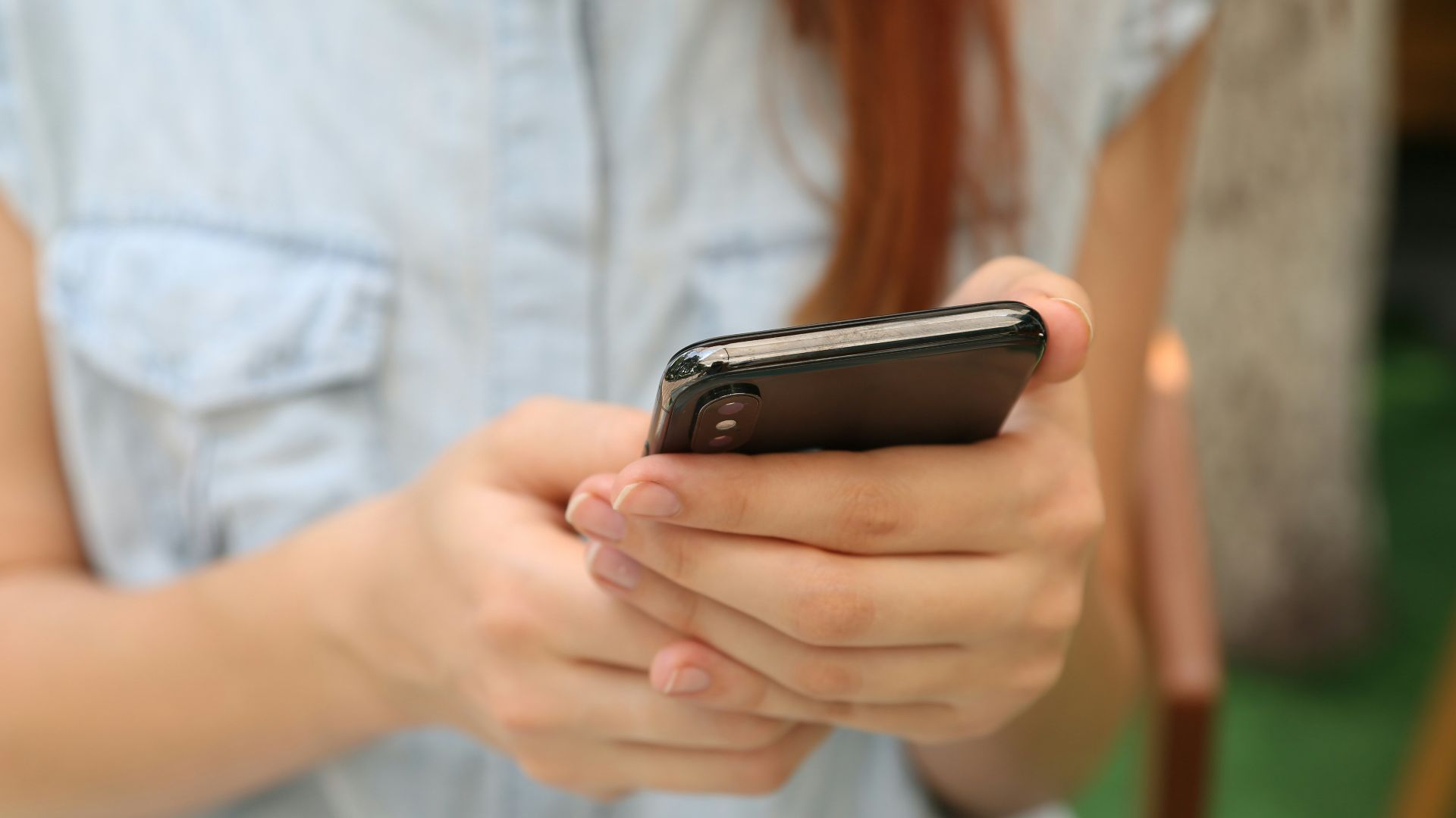 person holding using iPhone X