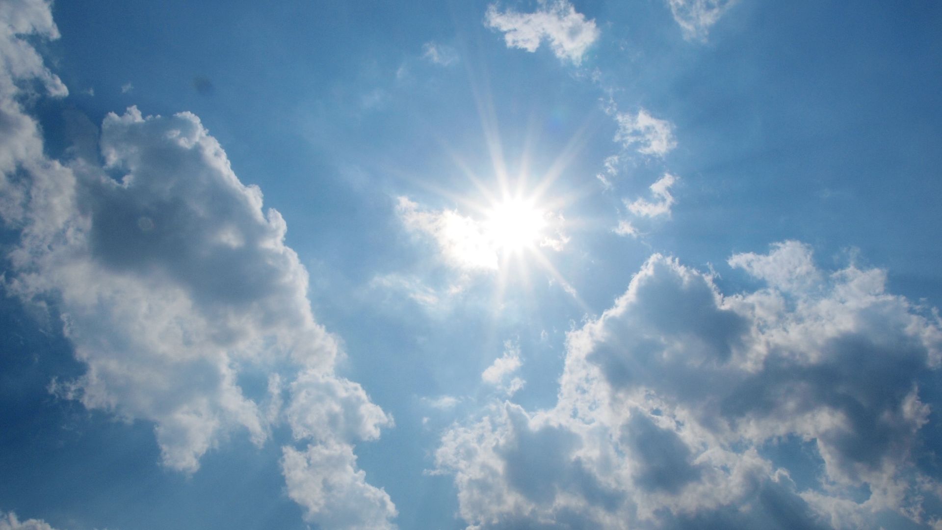 Sun within a cloudy sky
