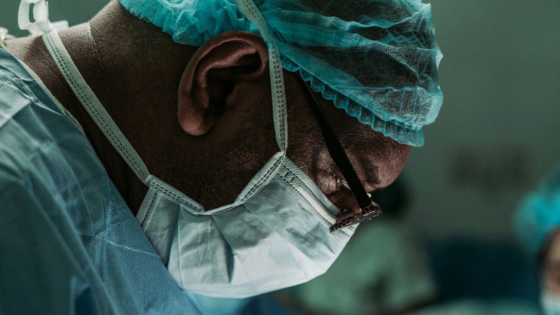man wearing medical mask and robe