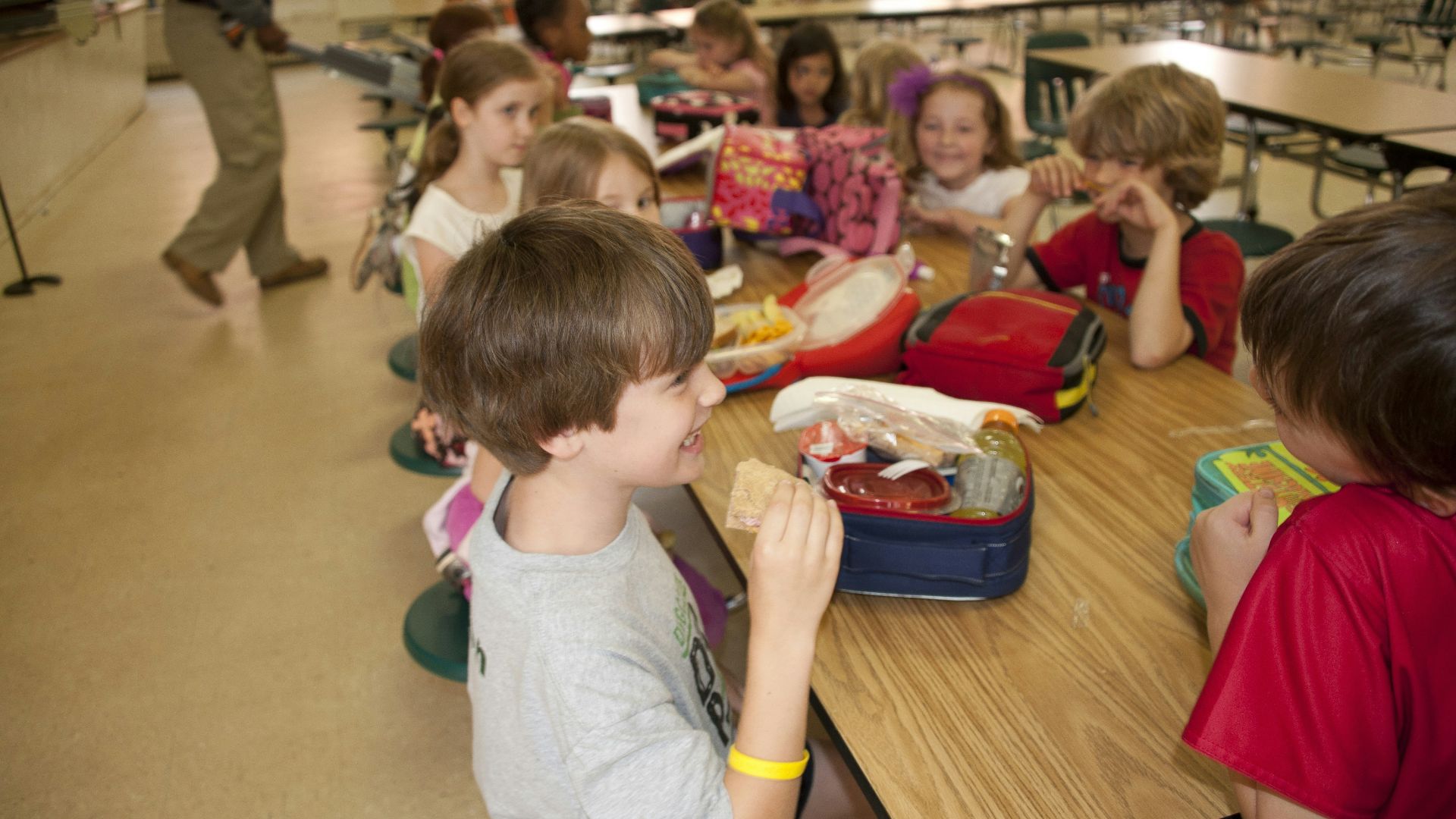 boy in gray crew neck t-shirt eating