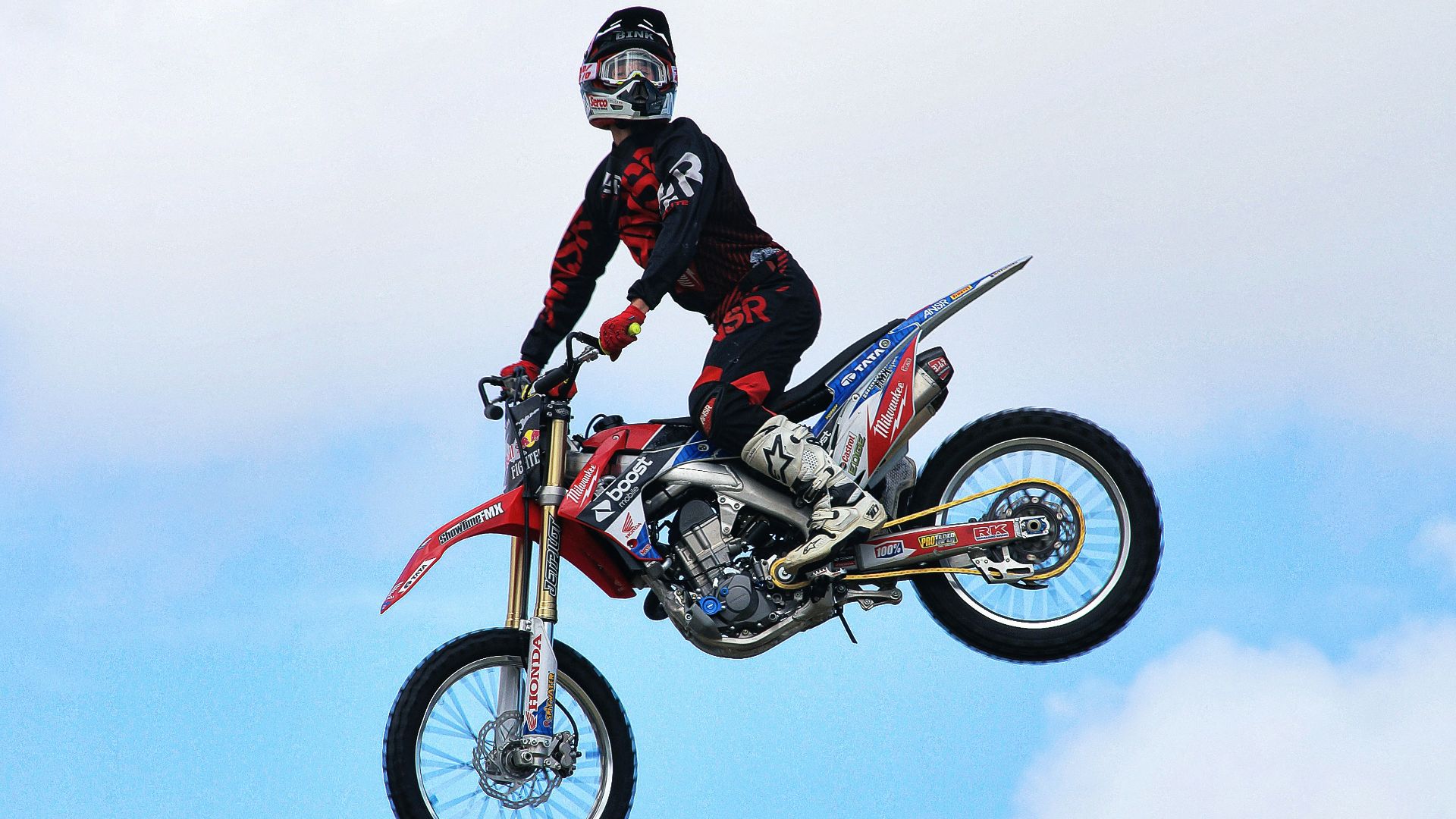 man riding dirt bike on air