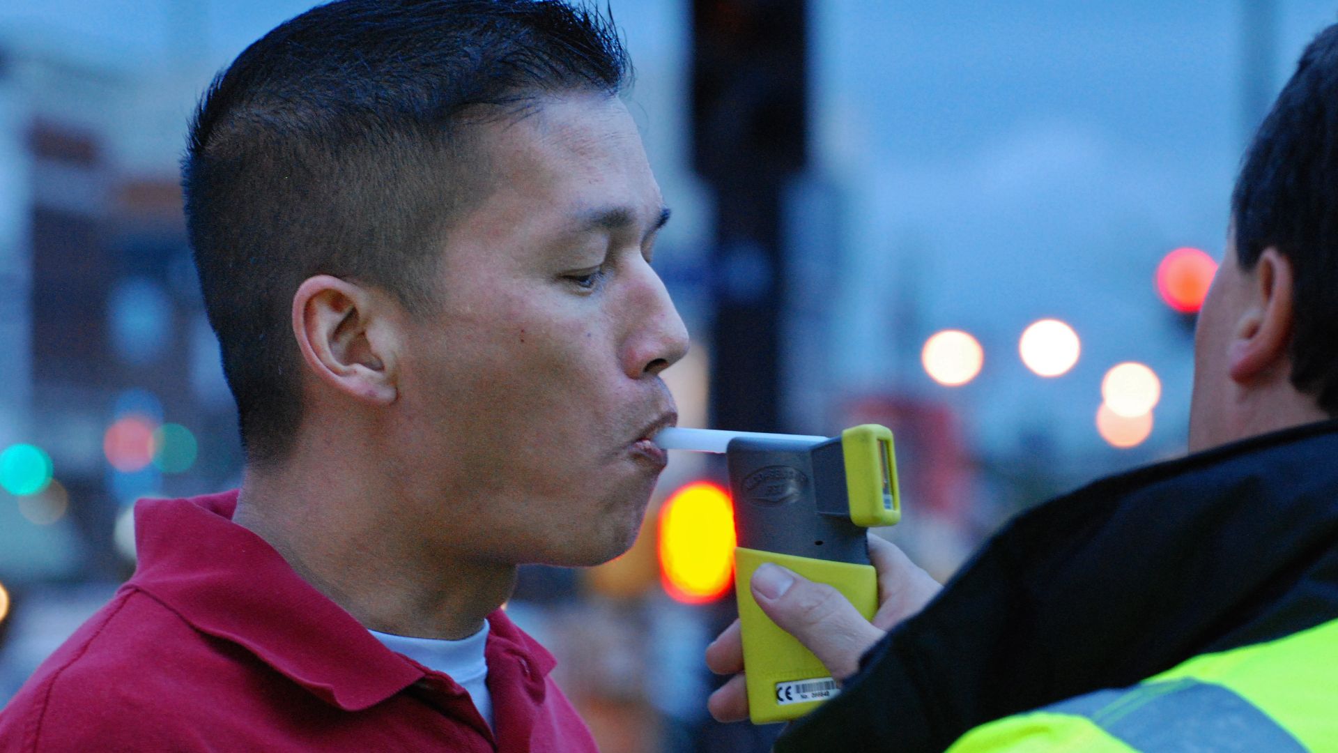 Tim Uong takes a Breathalyzer test at “Know Your Limit” in Columbia, Mo., on Friday, April 26, 2013. He says the event helped him learn how much one beer would affect his blood alcohol content level