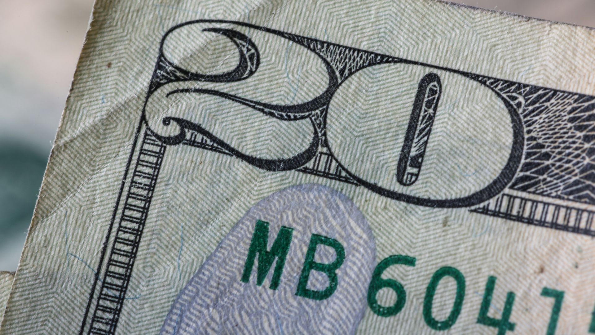 a close up of a twenty dollar bill
