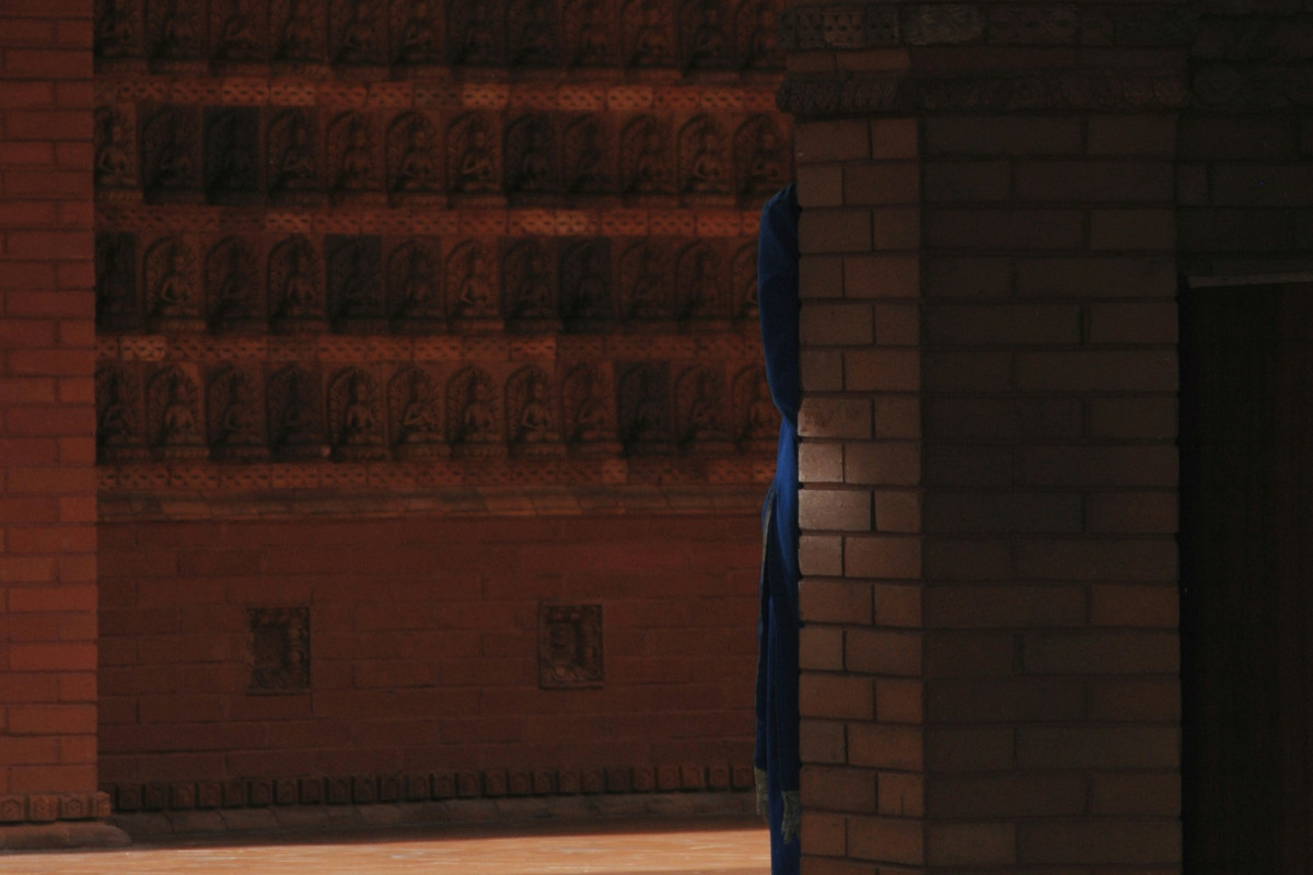 a man riding a skateboard on top of a sidewalk