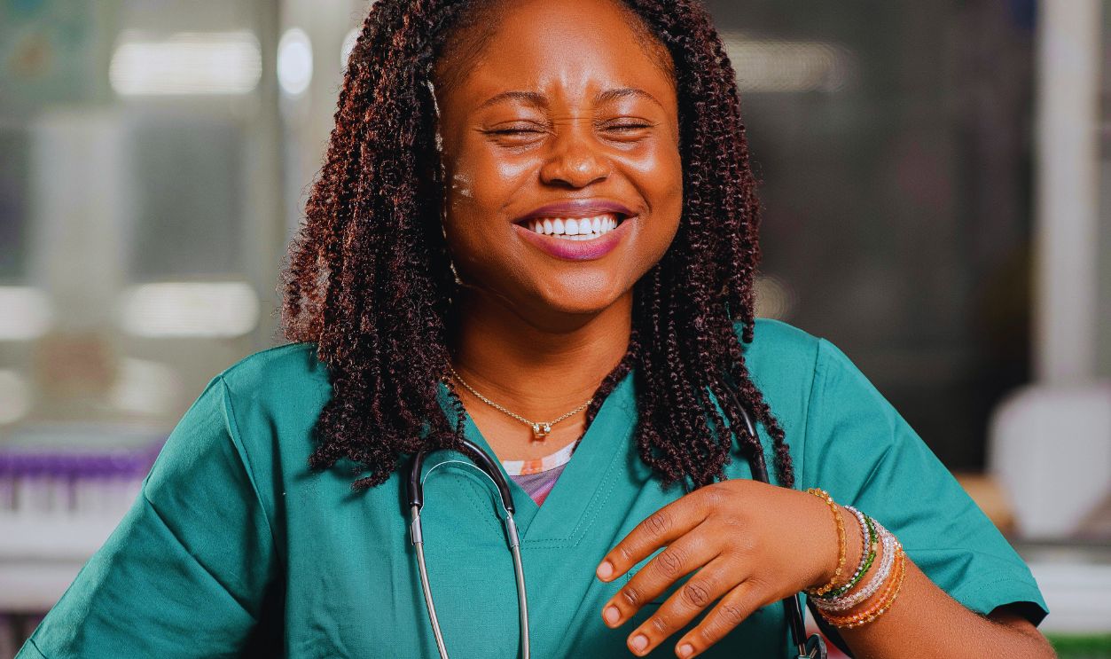 A Laughing Woman in a Doctors Gown