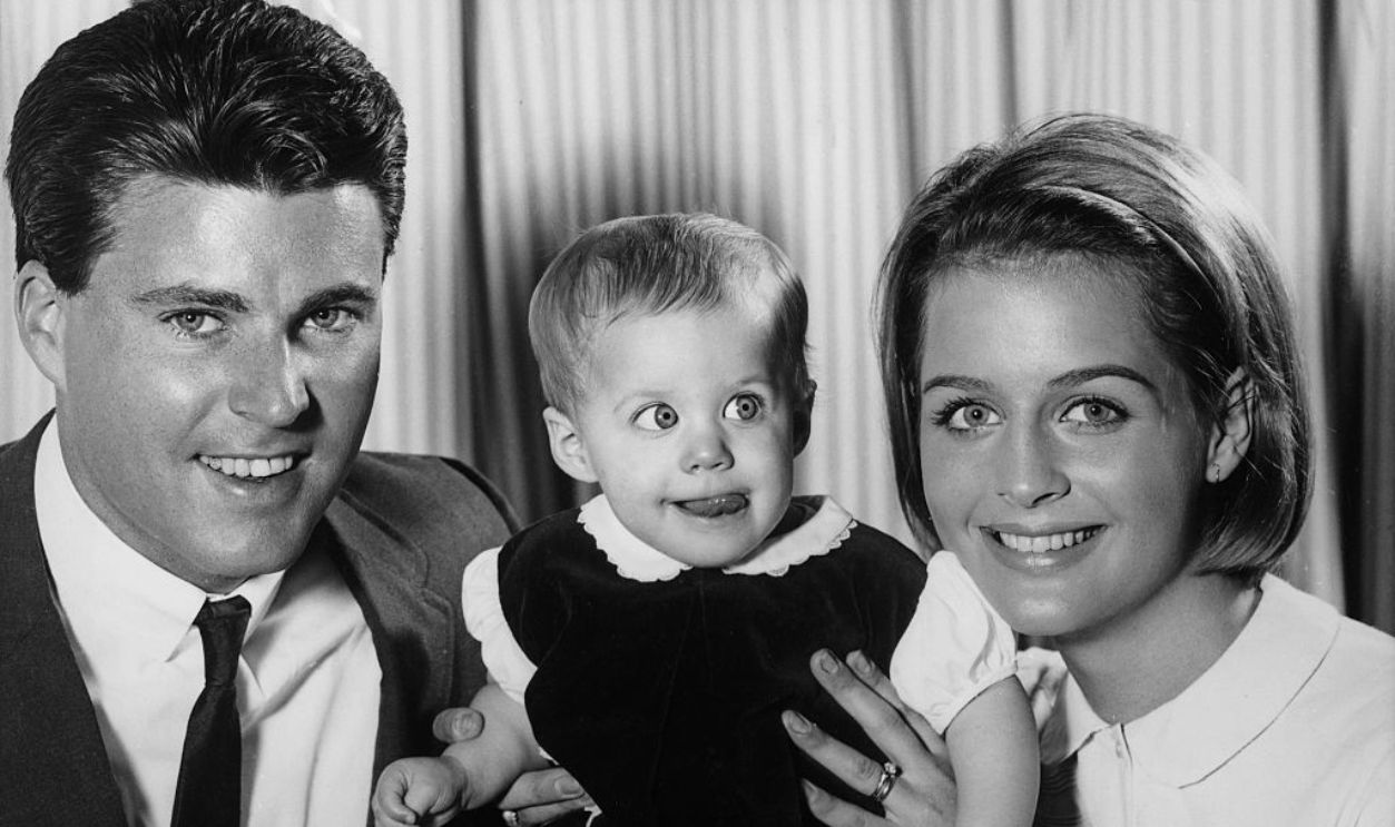 American actors Ricky Nelson (1940 - 1985) and wife Kristin Nelson (1945 - 2018) with their first-born child  	