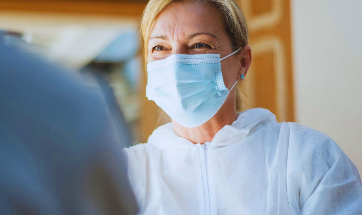 Woman Wearing Face Mask and Gloves