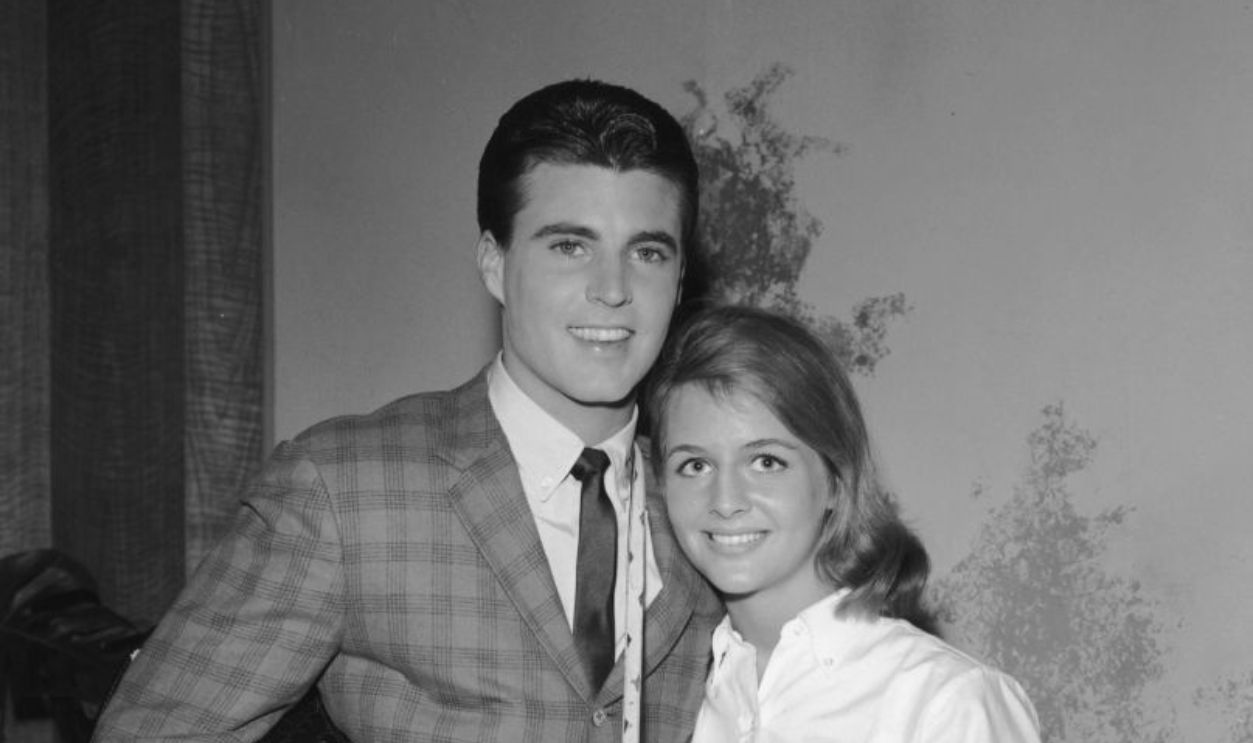 American rock n' roll singer Rick Nelson (1940-1985) smiles with his wife Kristin Harmon 