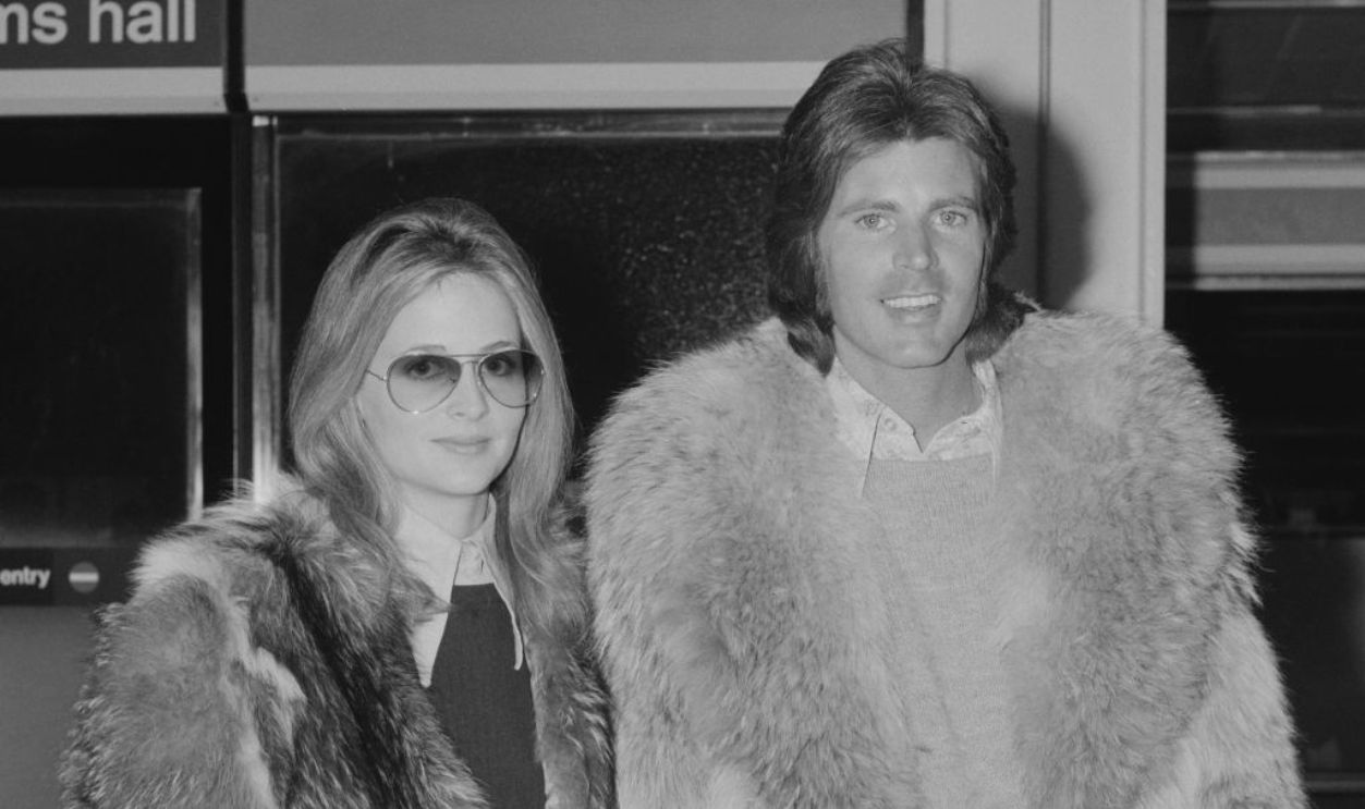 American rock and roll star Ricky Nelson (1940 - 1985) arrives at London Airport with his wife Kristin