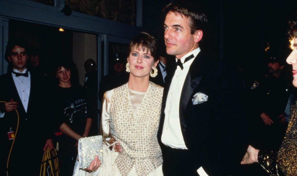 American actress Pam Dawber, wearing a white evening gown with a gold checked waistcoat, and American actor Mark Harmon