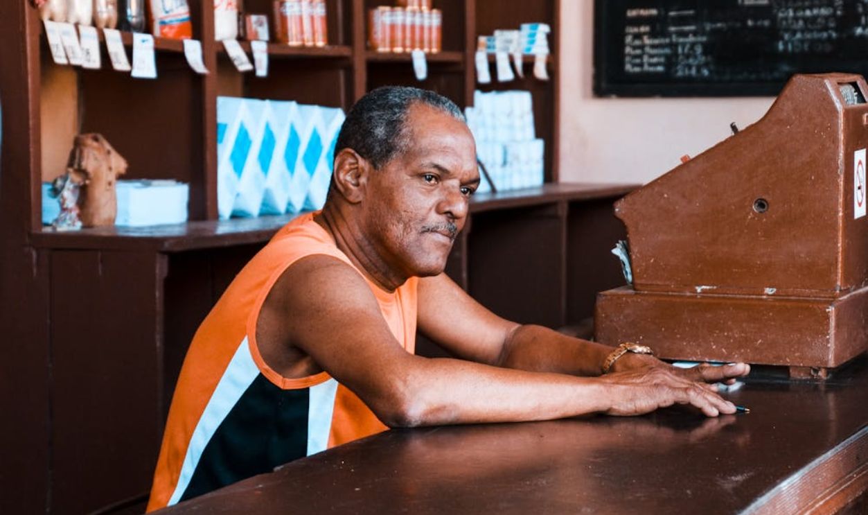 A Man Sitting at the Counter