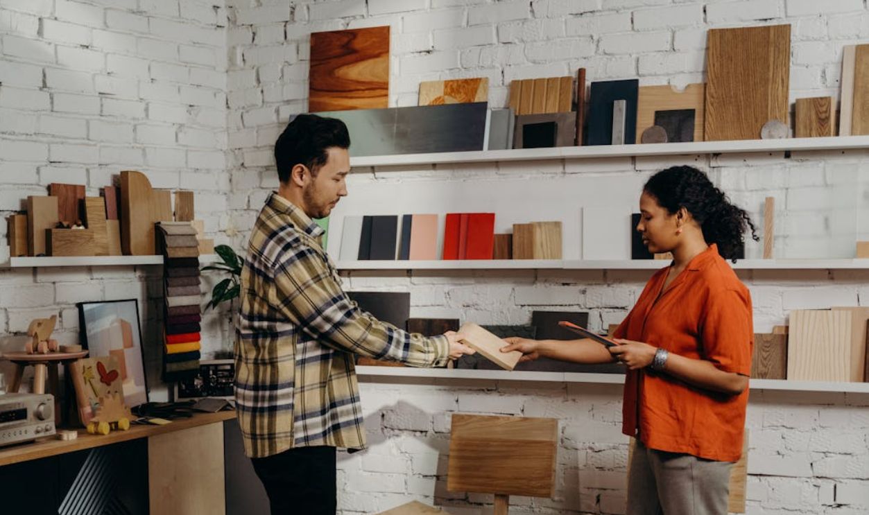 Employee Helping Customer in Store