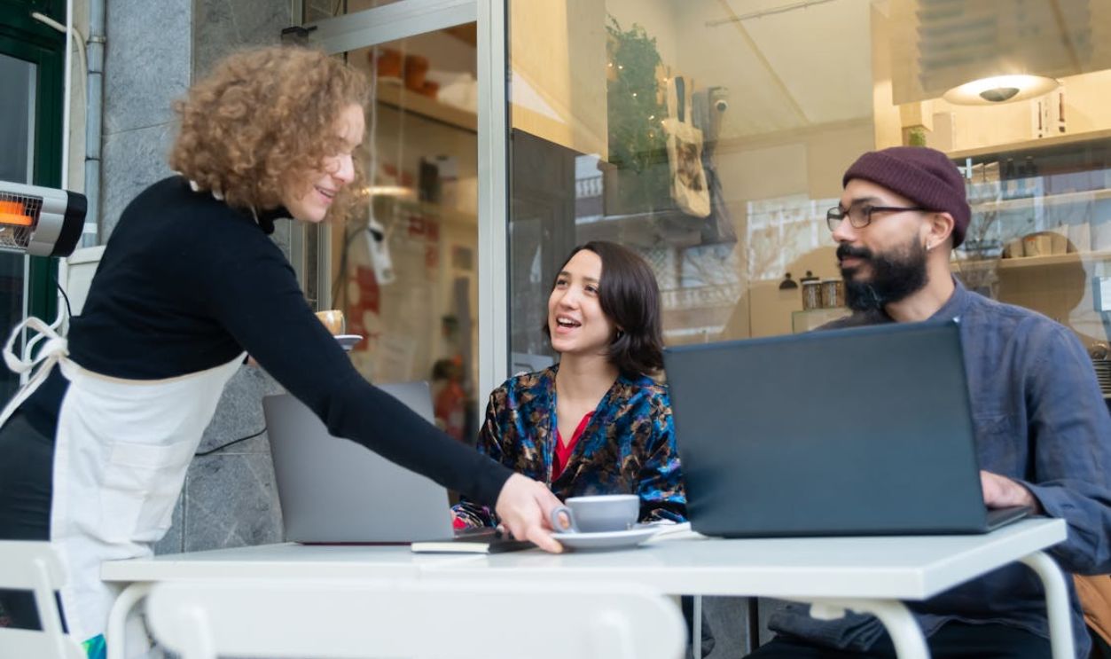 A Waitress Serving Her Customers