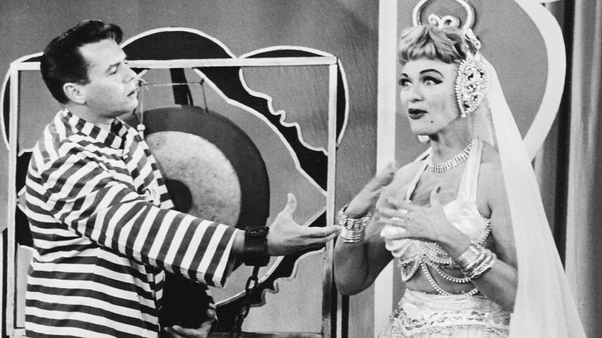 Photo of Desi Arnaz and Eve Arden from the television comedy Our Miss Brooks.  Connie (Arden) has a dream about a harem and guest star Desi is there.  However, Desi seems to be confused, as he believes Connie is Lucy.