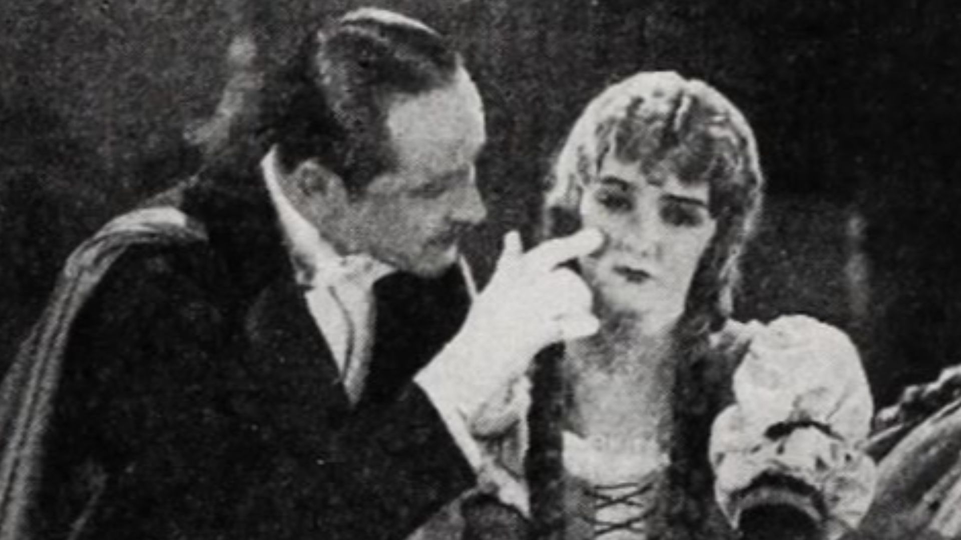 Still from the American horror film The Phantom of the Opera (1925) with Norman Kerry and Mary Philbin after the showing of Faust, on page 28 of the September 19, 1925 Exhibitors Herald.