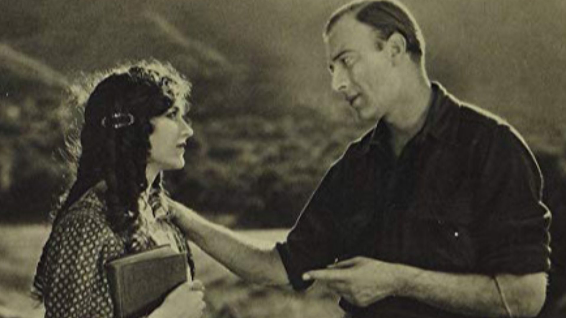 Still from the American drama film The Blazing Trail (1921) with Frank Mayo and Mary Philbin.