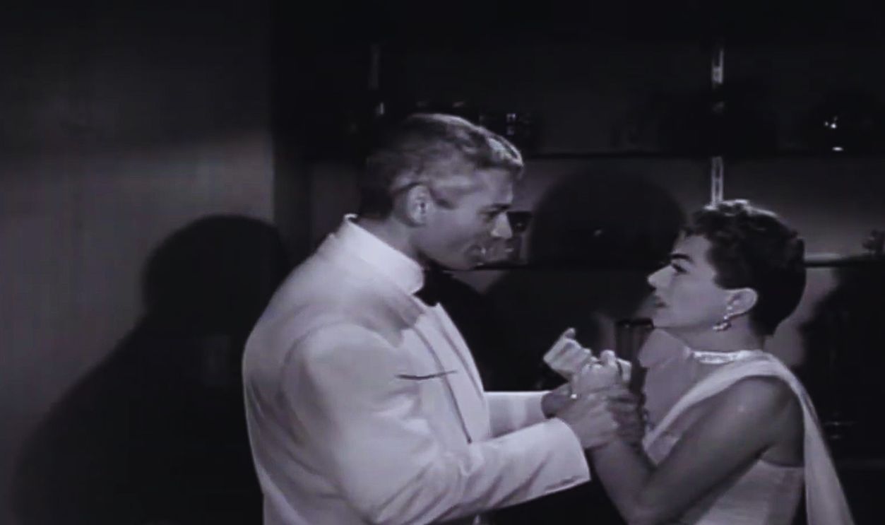Screenshot from Female on the Beach (1955) 