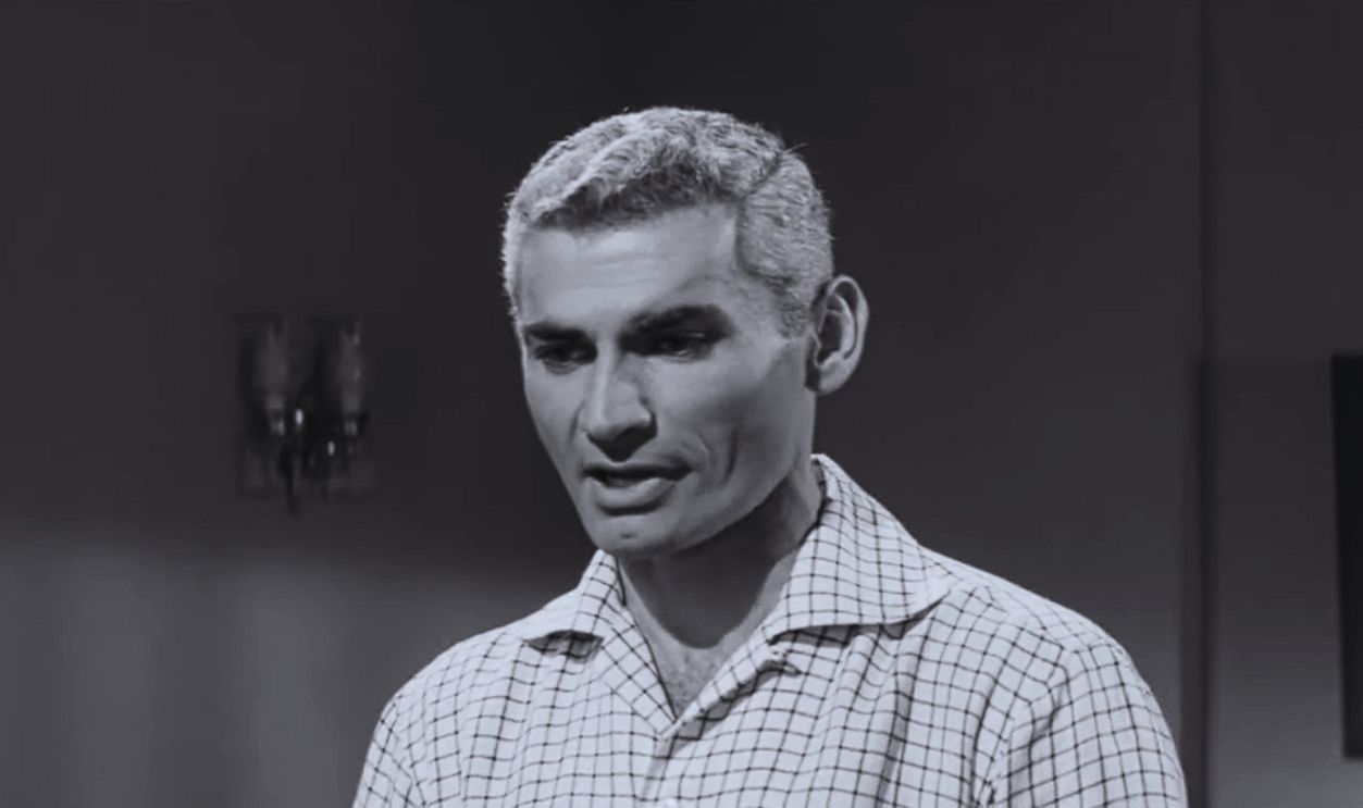 Screenshot from The Tattered Dress (1957) 