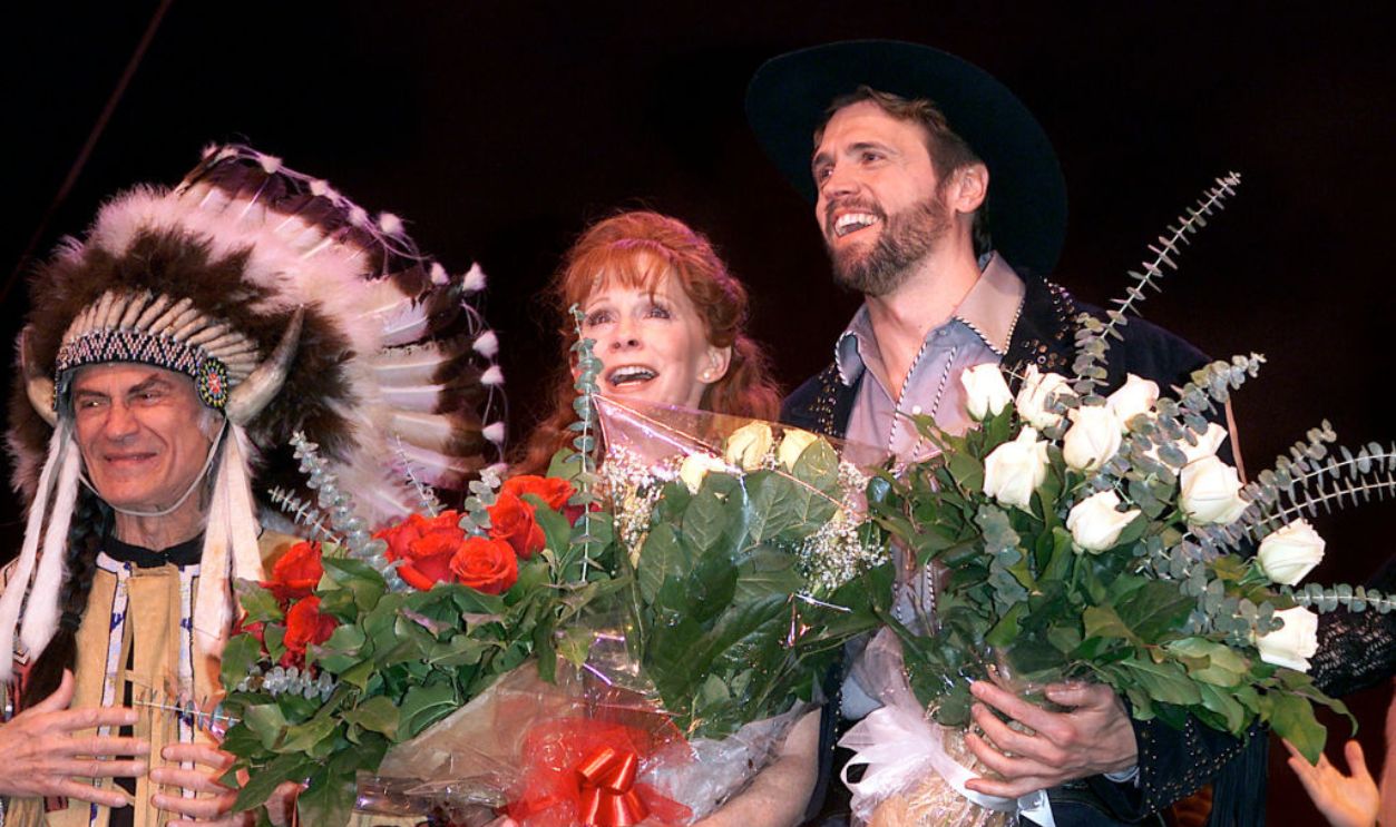 Reba McEntire takes over lead role in 'Annie Get Your Gun' on Broadway at the Marquis Theatre in New York City. Pictured: McEntire with co-stars Larry Storch and Brent Barrett during the curtain call.01/26/2001.